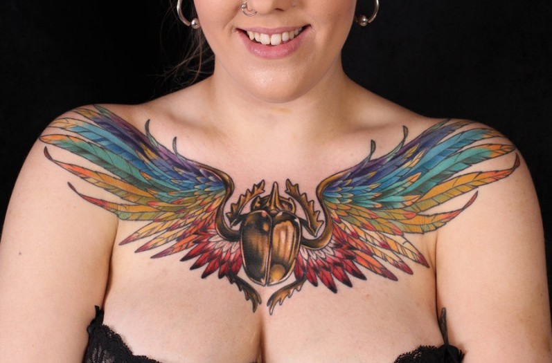 winged scarab chest tattoo