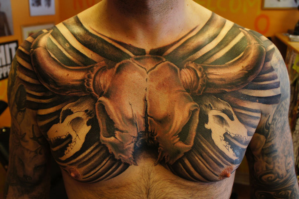 bull tattoo on chest of men