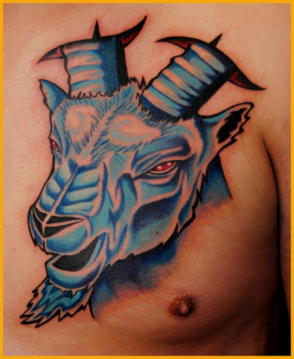 Capricorn Head With Red Eyes Tattoo On Man Chest