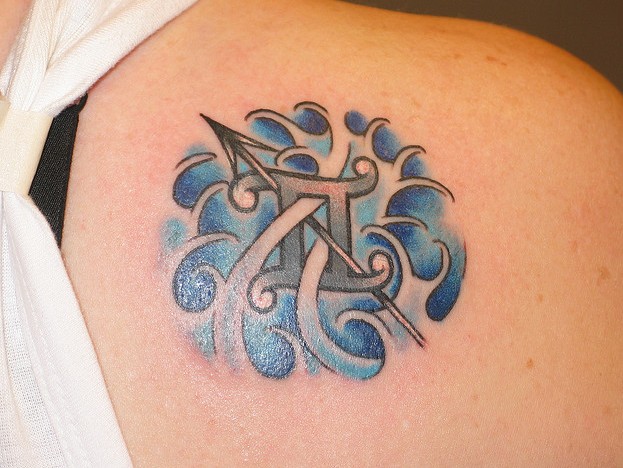 gemini tattoo design on lower back