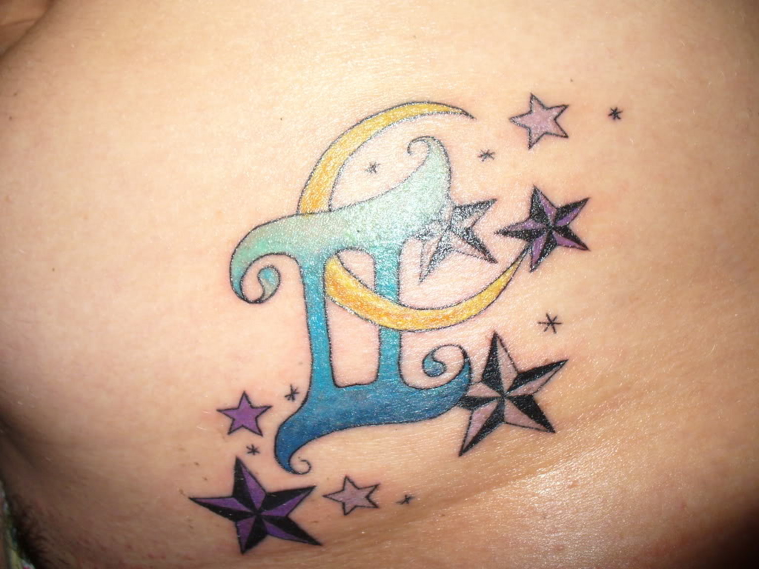 gemini tattoo with stars