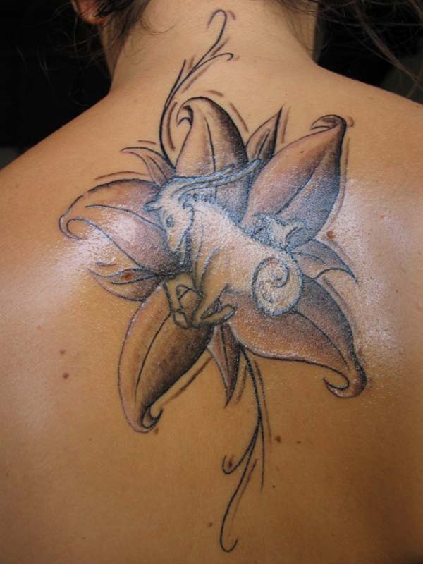shades of the flower with capricorn tattoo