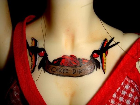 carpe diem tattoo on chest of female