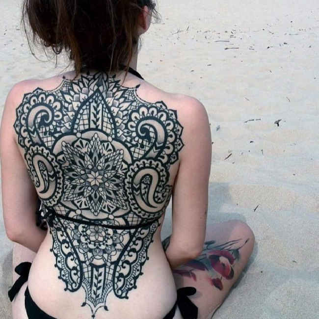 maori tattoo on back of female